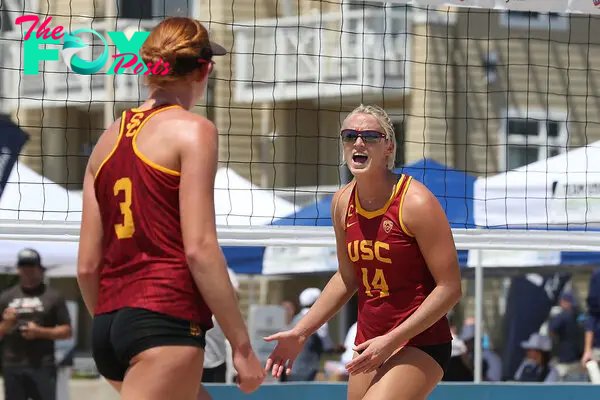 Hughes and Cheng, as teammates at USC, react to a point during the round of 16 match at the 2017 USA Volleyball Collegiate Beach Championships.