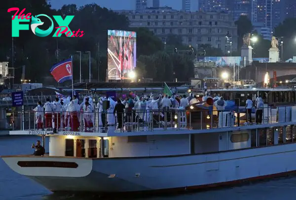 North Korean athletes ride a boat on the Seine River during the opening ceremony of the Paris Olympics.