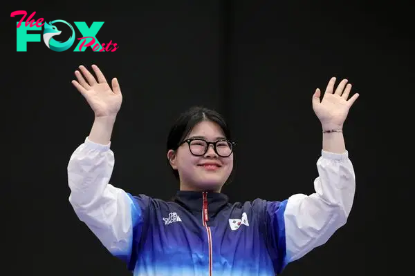 Gold medalist South Korea's Oh Ye Jin, reacts on the podium at the end of the shooting 10m air pistol women's Final during the Paris 2024 Olympic Games at Chateauroux Shooting Centre on July 28, 2024. (Photo by Alain JOCARD / AFP)