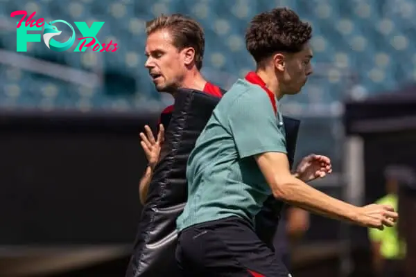 PHILADELPHIA - Sunday, July 28, 2024: Liverpool's lead physical performance coach Ruben Peeters (L) and Luke Chambers during an open training session at Lincoln Financial Field on day five of the club's pre-season tour of the USA. (Photo by David Rawcliffe/Propaganda)