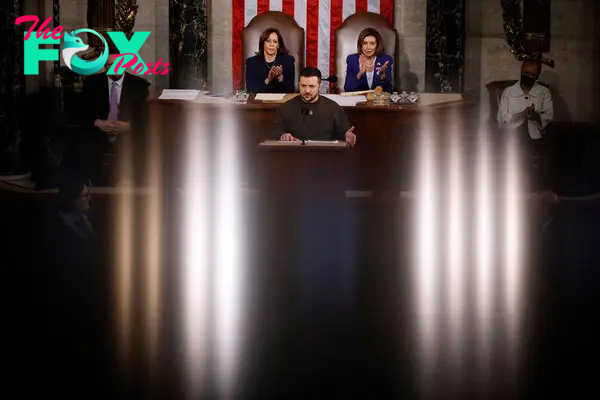 Vice President Kamala Harris and Speaker of the House Nancy Pelosi listen to President of Ukraine Volodymyr Zelensky as he addresses a joint meeting of Congress in the House Chamber of the U.S. Capitol on Dec. 21, 2022.