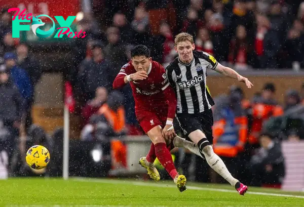 LIVERPOOL, ENGLAND - Monday, January 1, 2024: Newcastle United's Anthony Gordon (R) is challenged by Liverpool's Wataru End? during the FA Premier League match between Liverpool FC and Newcastle United FC on New Year's Day at Anfield. Liverpool won 4-2. (Photo by David Rawcliffe/Propaganda)