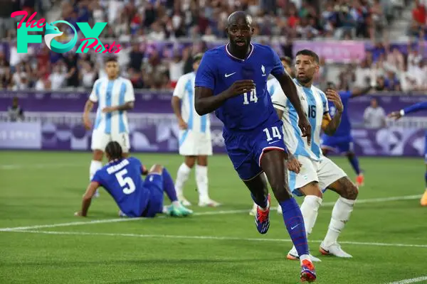 France's forward #14 Jean-Philippe Mateta celebrates scoring his team's first goal in the men's quarter-final football match between France and Argentina during the Paris 2024 Olympic Games at the Bordeaux Stadium in Bordeaux on August 2, 2024. (Photo by ROMAIN PERROCHEAU / AFP)