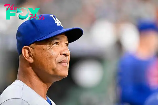 HOUSTON, TEXAS - JULY 26: Dave Roberts #30 of the Los Angeles Dodgers looks on from the dugout in the first inning against the against the Houston Astros at Minute Maid Park on July 26, 2024 in Houston, Texas.   Logan Riely/Getty Images/AFP (Photo by Logan Riely / GETTY IMAGES NORTH AMERICA / Getty Images via AFP)