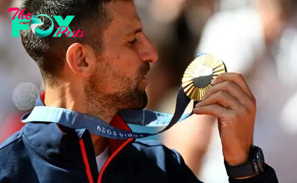 Love at last | Gold medal winner Novak Djokovic of Serbia