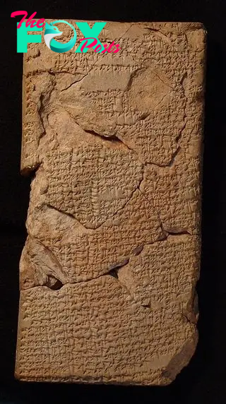 A long, rectangular tablet with cuneiform writing