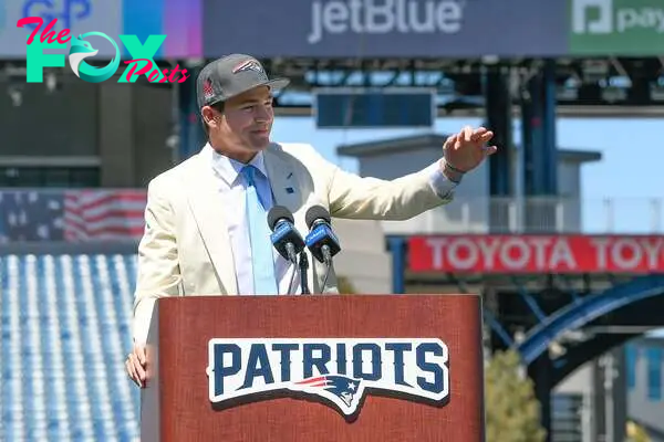 Apr 26, 2024; Foxborough, MA, USA; New England Patriots quarterback Drake Maye speaks to media on the game field after being drafted in the first round at Gillette Stadium. Mandatory Credit: Eric Canha-USA TODAY Sports