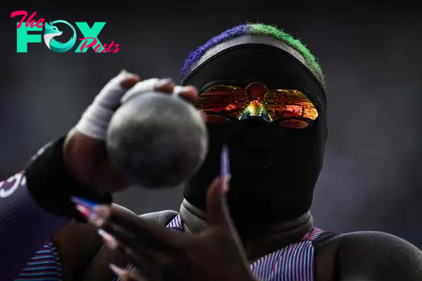 Saunders, a staunch advocate for social causes, appeared in the shot put qualifiers wearing a full-face mask and shades.