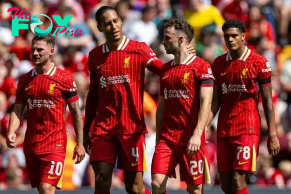 LIVERPOOL, ENGLAND - Sunday, August 11, 2024: Liverpool's Diogo Jota (R) celebrates with team-mate captain Virgil van Dijk after scoring the first goal during a pre-season friendly match between Liverpool FC and Sevilla FC at Anfield. (Photo by David Rawcliffe/Propaganda)