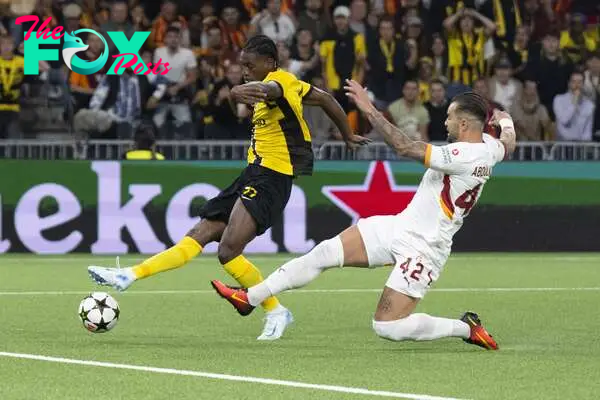 YB's Joel Monteiro (L) scores the 1-0 goal next to Galatasaray's Abduelkerim Bardakci during the UEFA Champions League play-off