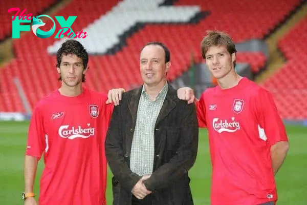 LIVERPOOL, ENGLAND - WEDNESDAY AUGUST 25th 2004: Liverpool's manager Rafael Benitez poses with his two new Spanish signings Luis Garcia (l) and Xabi Alonso (r) at Anfield. (Photo by David Rawcliffe/Propaganda)