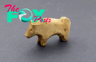 A small wooden carved ox or bull