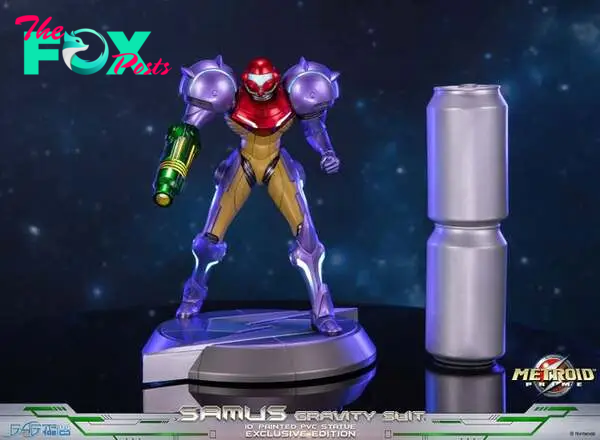 Metroid Prime statue next to two soda cans to give an idea of size