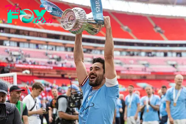 LONDON, ENGLAND - Saturday, June 3, 2023: Manchester City's ?lkay Gündo?an celebrates with the trophy after the FA Cup Final between Manchester City FC and Manchester United FC at Wembley Stadium. Man City won 2-1. (Pic by David Rawcliffe/Propaganda)