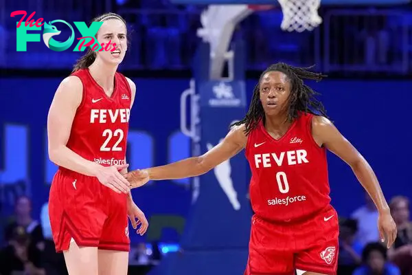 Kelsey Mitchell #0 of the Indiana Fever celebrates scoring with Caitlin Clark #22