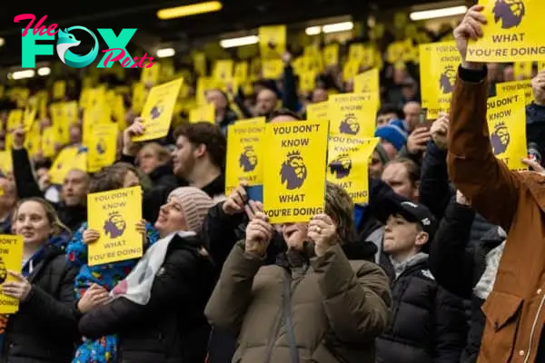 LIVERPOOL, ENGLAND - Saturday, February 3, 2024: Everton supporters with yellow cards "You Don't Know What You're Doing" printed on them, as they protest against the Premier League's 10-point deduction for breaking Profit & Sustainability rules, during the FA Premier League match between Everton FC and Tottenham Hotspur FC at Goodison Park. The game ended in a 2-2 draw. (Photo by David Rawcliffe/Propaganda)