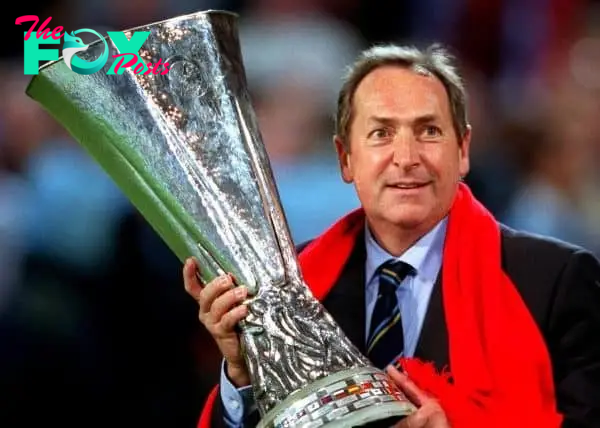 Liverpool manager Gerard Houllier proudly holds the UEFA Cup (PA Images)