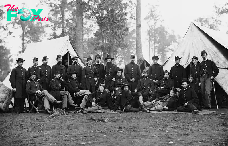 Photograph of the assembled officers of the 80th New York Infantry (20th N.Y.S.M.) at their encampment at Culpepper, Virginia. Glass collodion wet negative. The Library of Congress, Washington, D.C. 1863