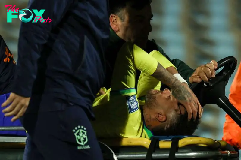 Neymar is stretchered off after tearing his ACL in Brazil's 2026 World Cup qualifier against Uruguay in October 2023. 