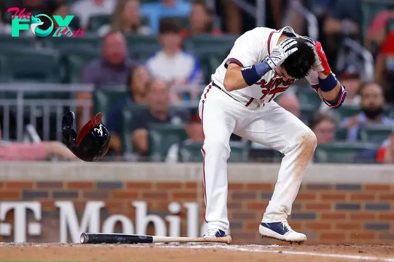 ATLANTA, GEORGIA - SEPTEMBER 3: Whit Merrifield #15 of the Atlanta Braves is hit in the head by a pitch during the seventh inning against the Colorado Rockies at Truist Park on September 3, 2024 in Atlanta, Georgia.   Todd Kirkland/Getty Images/AFP (Photo by Todd Kirkland / GETTY IMAGES NORTH AMERICA / Getty Images via AFP)