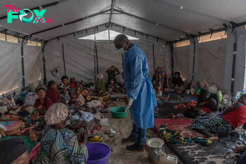 Doctor Robert Musole, medical director of the Kavumu hospital, visits patients recovering from mpox in the village of Kavumu, in eastern Democratic Republic of Congo on Aug. 24, 2024.