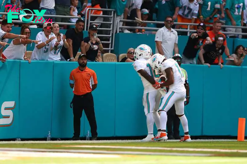 Tyreek Hill and Jaylen Waddle of the Miami Dolphins celebrate after Hill's touchdown against the Jacksonville Jaguars.