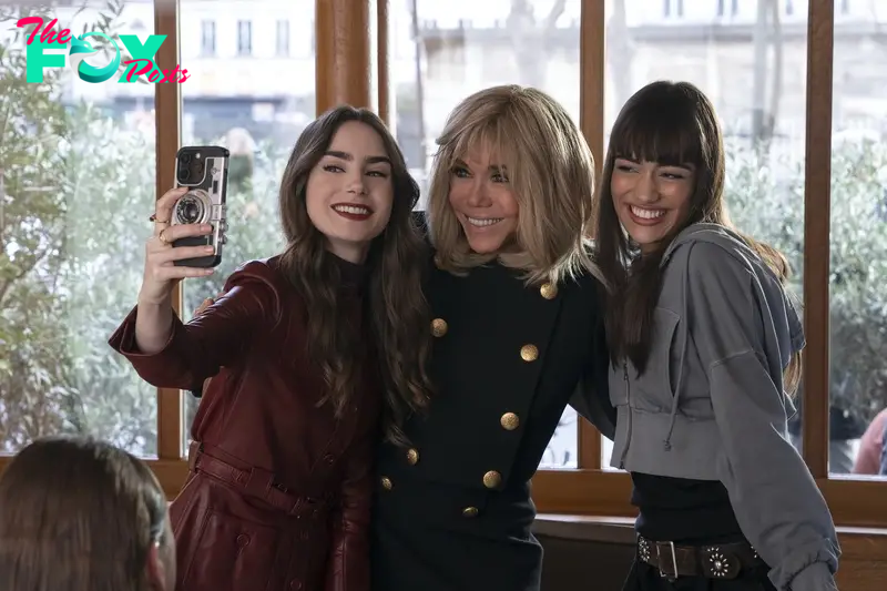 Emily in Paris. (L to R) Lily Collins as Emily, Brigitte Macron as self, Thalia Besson as Genevieve in episode 407 of Emily in Paris. Cr. Stephanie Branchu/Netflix © 2024