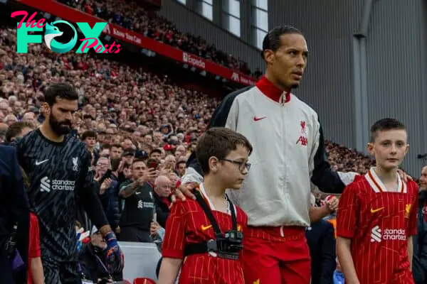 LIVERPOOL, ENGLAND - Sunday, August 25, 2024: Liverpool's captain Virgil van Dijk leads his side out before the FA Premier League match between Liverpool FC and Brentford FC at Anfield. Liverpool won 2-0. (Photo by David Rawcliffe/Propaganda)