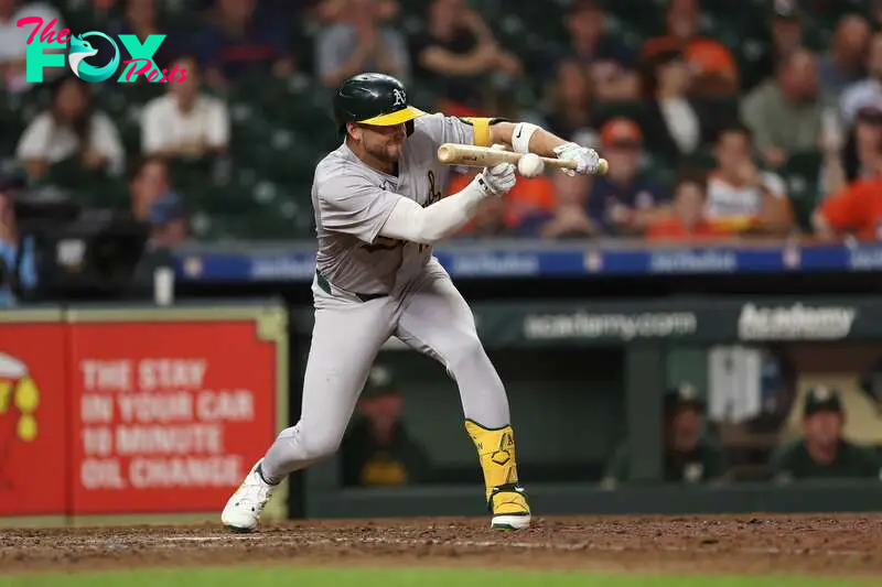 HOUSTON, TEXAS - SEPTEMBER 10: Max Schuemann #12 of the Oakland Athletics hits a sacrifice bunt that scored Zack Gelof #20 (not pictured) in the twelfth inning \ah at Minute Maid Park on September 10, 2024 in Houston, Texas.   Tim Warner/Getty Images/AFP (Photo by Tim Warner / GETTY IMAGES NORTH AMERICA / Getty Images via AFP)