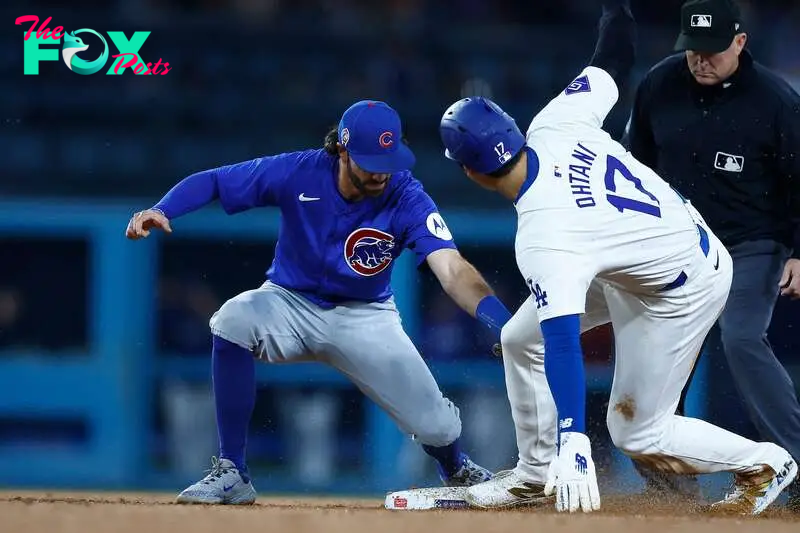 LOS ANGELES, CALIFORNIA - SEPTEMBER 11: Shohei Ohtani #17 of the Los Angeles Dodgers steals second base in front of Dansby Swanson #7 of the Chicago Cubs in the second inning at Dodger Stadium on September 11, 2024 in Los Angeles, California. 776096911   Ronald Martinez/Getty Images/AFP (Photo by RONALD MARTINEZ / GETTY IMAGES NORTH AMERICA / Getty Images via AFP)