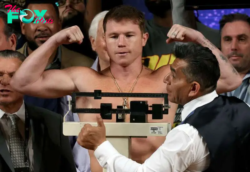 (FILES) Mexican boxer Canelo Alvarez gestures during the weigh-in ceremony prior to his fight against British boxer John Ryder for the WBA, WBC, IBF and WBO super middleweight titles in Guadalajara, Mexico, on May 5, 2023. Mexican superstar Canelo Alvarez announced on July 25, 2024 that he will defend three super-middleweight world boxing titles on September 14 against undefeated Edgar Berlanga in Las Vegas. (Photo by ULISES RUIZ / AFP)