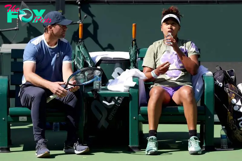 (FILES) Naomi Osaka of Japan confers with coach Wim Fissette while training in preparation for the BNP Paribas Open at Indian Wells Tennis Garden on March 05, 2024 in Indian Wells, California. Japanese tennis star Naomi Osaka is parting ways with Belgian coach Wim Fissette, the former world number one said on Instagram on September 13, 2024. (Photo by MATTHEW STOCKMAN / GETTY IMAGES NORTH AMERICA / AFP)