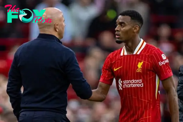 LIVERPOOL, ENGLAND - Sunday, August 25, 2024: Liverpool's Ryan Gravenberch embraces head coach Arne Slot as he is substituted during the FA Premier League match between Liverpool FC and Brentford FC at Anfield. Liverpool won 2-0. (Photo by David Rawcliffe/Propaganda)