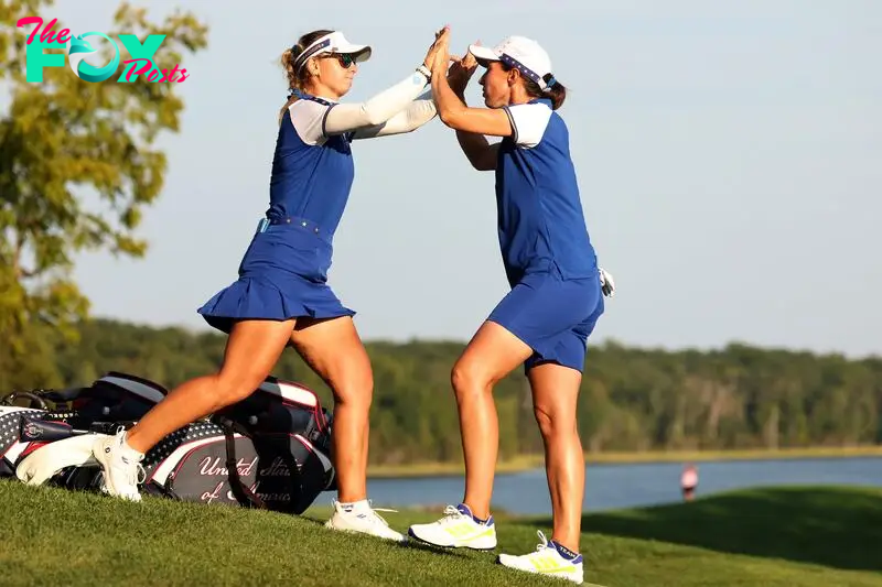 Emily Pedersen and Carlota Ciganda of Team Europe celebrate their win on the 17th hole during the Saturday Fourball matches 