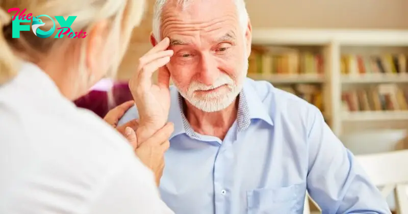 Senior with dementia or Alzheimer's is comforted by caring female doctor