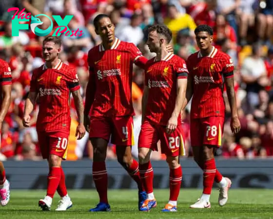 LIVERPOOL, ENGLAND - Sunday, August 11, 2024: Liverpool's Diogo Jota (R) celebrates with team-mate captain Virgil van Dijk after scoring the first goal during a pre-season friendly match between Liverpool FC and Sevilla FC at Anfield. (Photo by David Rawcliffe/Propaganda)