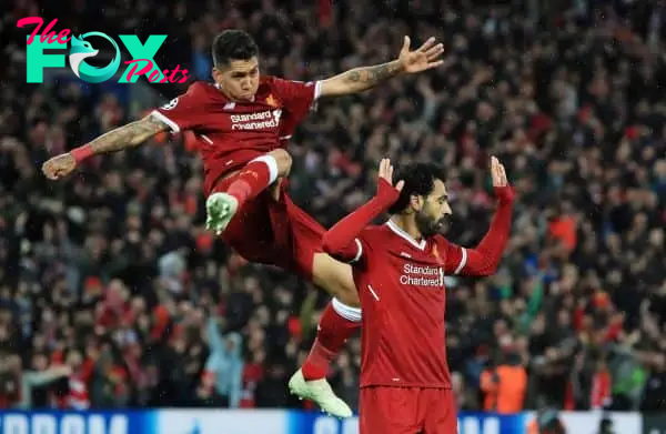 Liverpool's Mohamed Salah (right) celebrates scoring his side's second goal of the game with Roberto Firmino during the UEFA Champions League, Semi Final First Leg match at Anfield, Liverpool.