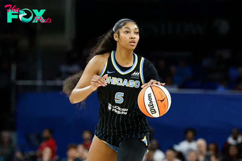 Aug 25, 2024; Chicago, Illinois, USA; Chicago Sky forward Angel Reese (5) looks to pass the ball against the Las Vegas Aces during the first half at Wintrust Arena. Mandatory Credit: Kamil Krzaczynski-USA TODAY Sports