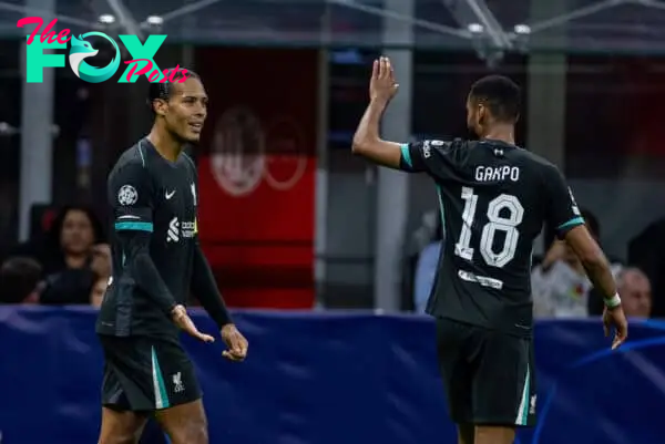 MILAN, ITALY - Tuesday, September 17, 2024: Liverpool's captain Virgil van Dijk (L) celebrates with team-mate Cody Gakpo after scoring the second goal during the UEFA Champions League game between AC Milan and Liverpool FC at the Stadio San Siro. (Pic by David Rawcliffe/Propaganda)