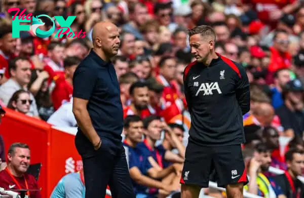 LIVERPOOL, ENGLAND - Sunday, August 11, 2024: Liverpool's head coach Arne Slot (L) and first team individual development coach Aaron Briggs during a pre-season friendly match between Liverpool FC and Sevilla FC at Anfield. (Photo by David Rawcliffe/Propaganda)