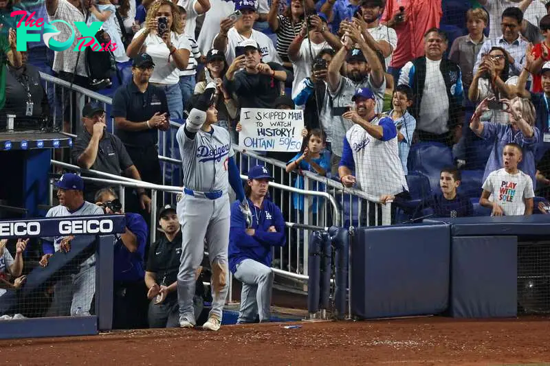 MIAMI, FLORIDA - SEPTEMBER 19: Shohei Ohtani #17 of the Los Angeles Dodgers hits a home run against the Miami Marlins during the seventh inning of the game at loanDepot park on September 19, 2024 in Miami, Florida. Ohtani is now the first MLB player to have at least 50 home runs and 50 stolen bases in the same season.   Chris Arjoon/Getty Images/AFP (Photo by Chris Arjoon / GETTY IMAGES NORTH AMERICA / Getty Images via AFP)