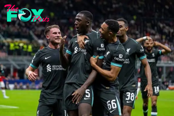 MILAN, ITALY - Tuesday, September 17, 2024: Liverpool's Ibrahima Konaté (C) celebrates with team-mates Alexis Mac Allister (L) and Trent Alexander-Arnold (R) after scoring his side's first equalising goal during the UEFA Champions League game between AC Milan and Liverpool FC at the Stadio San Siro. (Pic by David Rawcliffe/Propaganda)