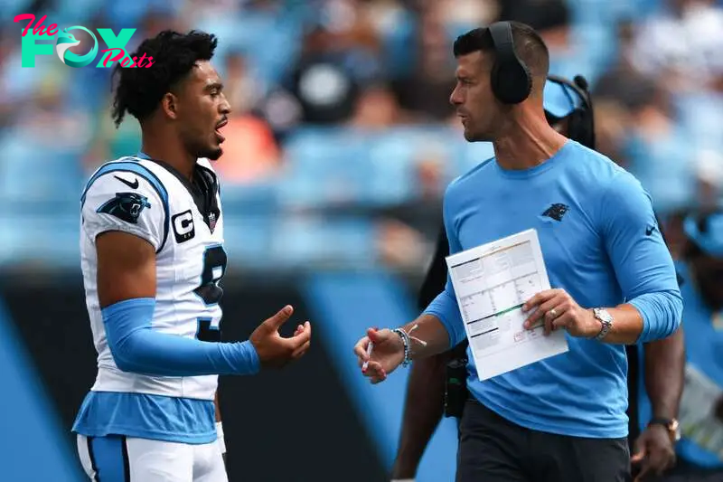 CHARLOTTE, NORTH CAROLINA - SEPTEMBER 15: Quarterback Bryce Young #9 talks with head coach Dave Canales of the Carolina Panthers talks with at Bank of America Stadium on September 15, 2024 in Charlotte, North Carolina.   Jared C. Tilton/Getty Images/AFP (Photo by Jared C. Tilton / GETTY IMAGES NORTH AMERICA / Getty Images via AFP)