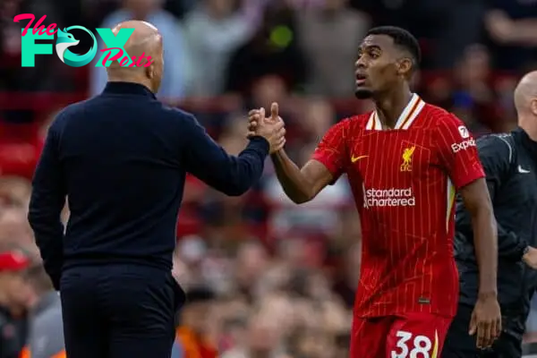 LIVERPOOL, ENGLAND - Sunday, August 25, 2024: Liverpool's Ryan Gravenberch embraces head coach Arne Slot as he is substituted during the FA Premier League match between Liverpool FC and Brentford FC at Anfield. Liverpool won 2-0. (Photo by David Rawcliffe/Propaganda)