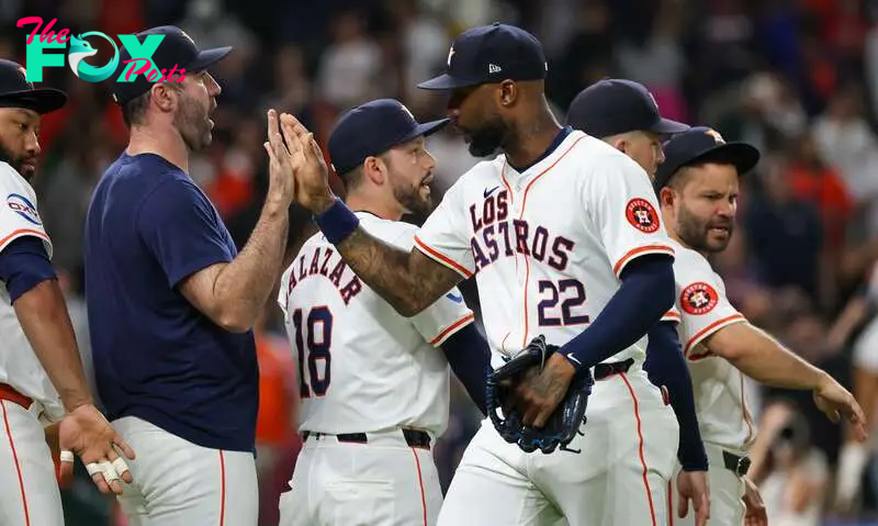 Sep 21, 2024; Houston, Texas, USA; Houston Astros starting pitcher Justin Verlander (35) and right fielder Jason Heyward (22) celebrate the win after defeating the Los Angeles Angels at Minute Maid Park. Mandatory Credit: Thomas Shea-Imagn Images