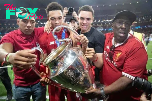 MADRID, SPAIN - SATURDAY, JUNE 1, 2019: Liverpool's Trent Alexander-Arnold celebrates with the trophy and his family after the UEFA Champions League Final match between Tottenham Hotspur FC and Liverpool FC at the Estadio Metropolitano. Liverpool won 2-0 to win their sixth European Cup. (Pic by Peter Makadi/Propaganda)