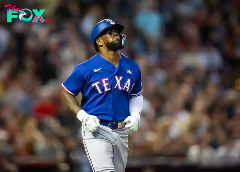 Oct 30, 2023; Phoenix, AZ, USA; Texas Rangers right fielder Adolis Garcia (53) reacts after after suffering an injury in the eighth inning of game three of the 2023 World Series against the Arizona Diamondbacks at Chase Field. Mandatory Credit: Mark J. Rebilas-USA TODAY Sports