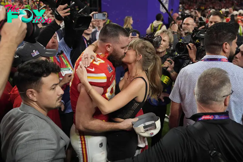 Travis Kelce and Taylor Swift kissing after the Super Bowl in February 2024