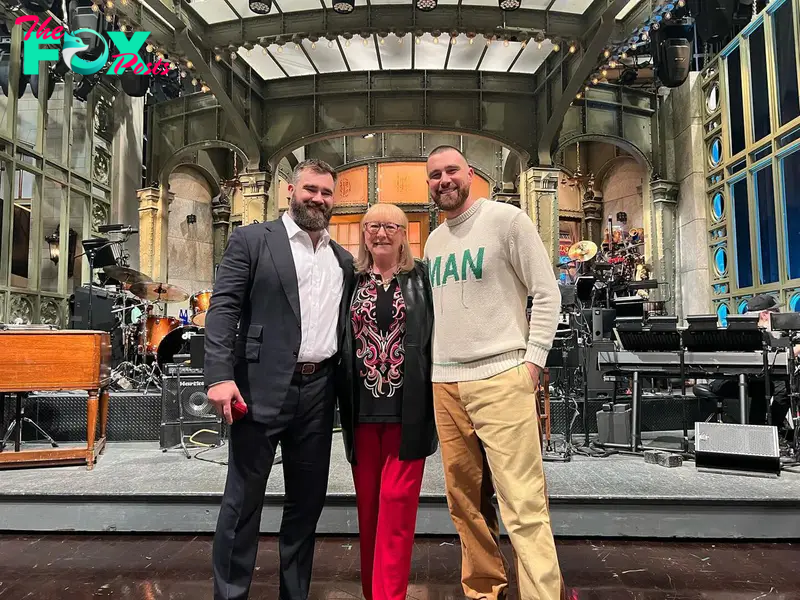 Jason Kelce, Donna Kelce and Travis Kelce in front of the "SNL" stage