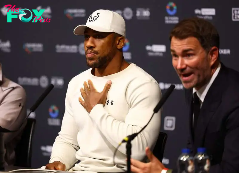 Boxing - Daniel Dubois v Anthony Joshua - IBF World Heavyweight Title - Wembley Stadium, London, Britain - September 22, 2024 Anthony Joshua with promoter Eddie Hearn during the press conference after losing his fight against Daniel Dubois Action Images via Reuters/Andrew Boyers